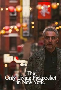 Movie poster for The Only Living Pickpocket in New York. A gray-haired man in a patterned overcoat stands on a narrow city street at dusk, looking off to the side. Glowing red lanterns and signs with Chinese characters hang behind him. The title appears in white serif type.