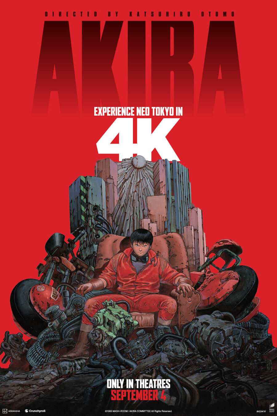 Movie poster for Akira. Illustration of a young man in a red jacket seated on a throne built from motorcycle wreckage and scrap machinery, with a city skyline rising behind him against a flat red background. The title spans the top in dark red capitals. Only in theatres September 4.