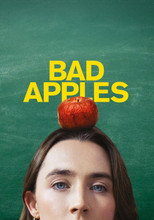 Movie poster for Bad Apples. A woman's face fills the lower half of the frame against a green chalkboard, cropped just above the eyes so that only her eyes and forehead are visible. A red apple sits balanced on top of her head. The title appears above in large yellow capitals.