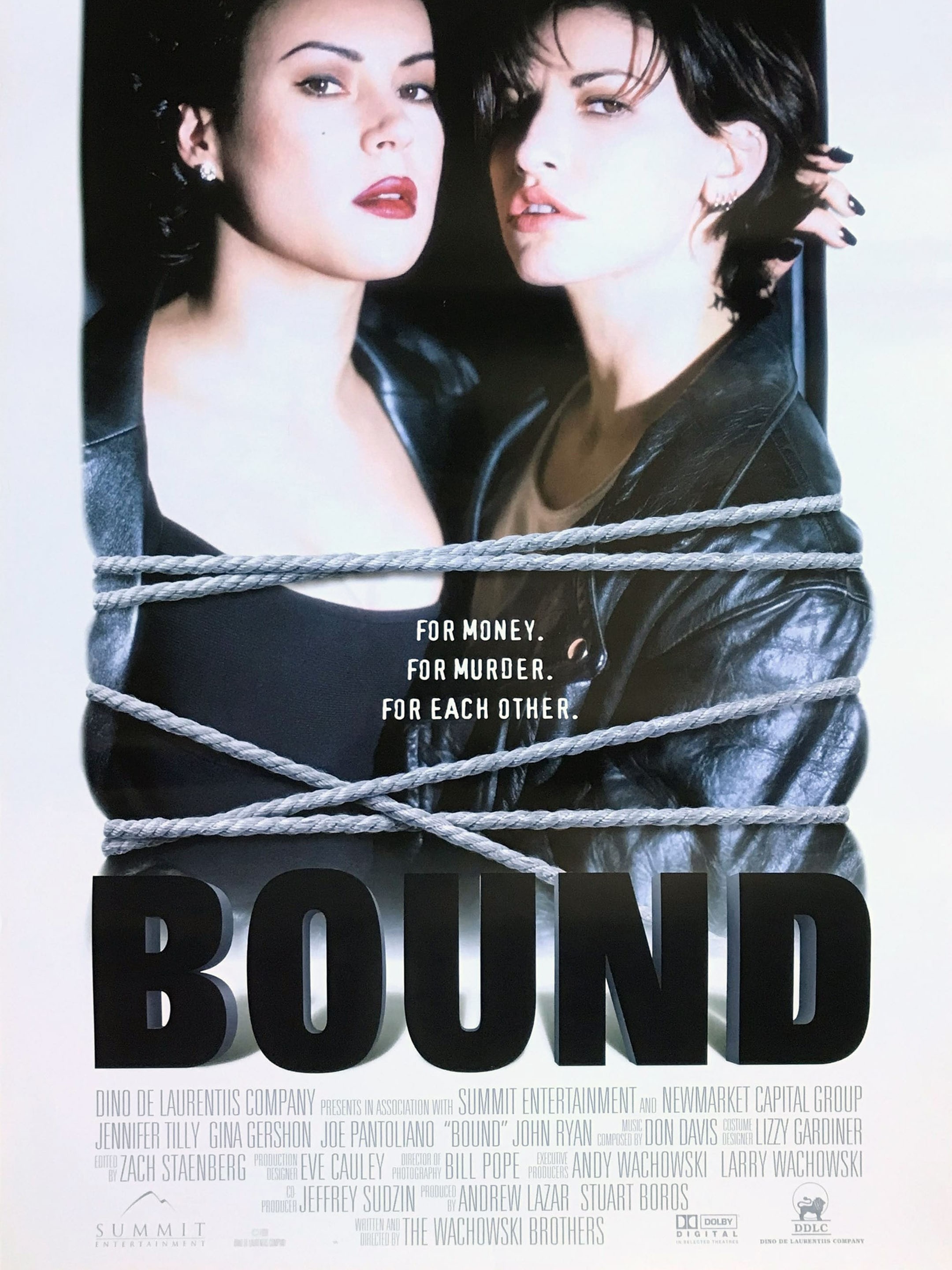 Movie poster for Bound. Two women stand pressed close together against a white background, one in a dark top and one in a black leather jacket, both looking off to the right. Gray rope is wound repeatedly around them from chest to waist, binding them together. The tagline "For money. For murder. For each other." appears at center right. The title runs across the bottom in large black capitals.