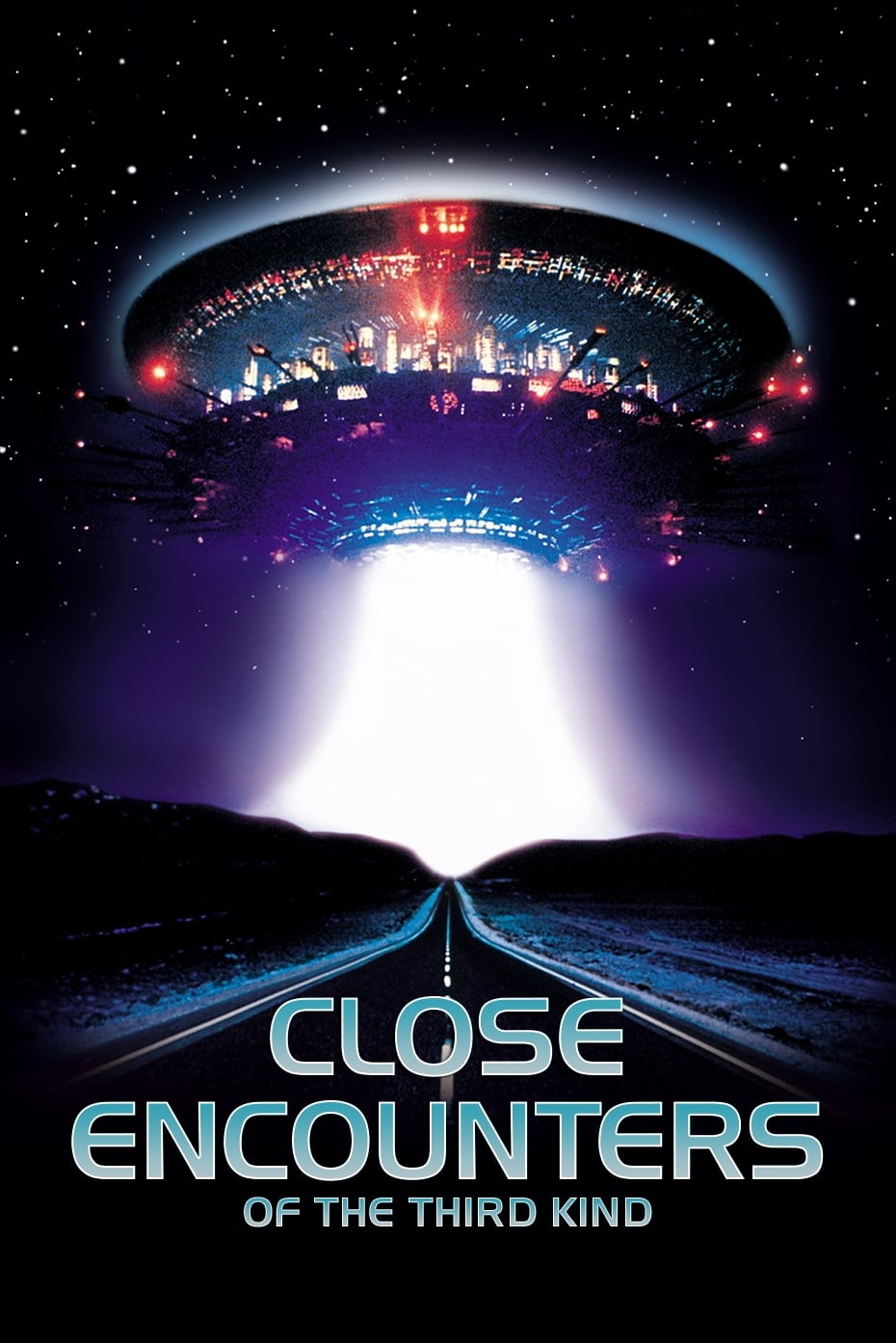 Movie poster for Close Encounters of the Third Kind. A large saucer-shaped craft covered in red and blue lights hovers in a starry night sky, casting a wide beam of white light down onto an empty two-lane road that runs toward the horizon. The title appears at the bottom in pale blue letters.
