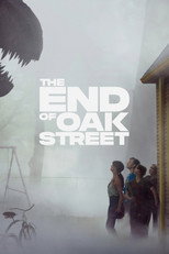 Movie poster for The End of Oak Street. Three figures stand together in a driveway looking toward a house, mostly obscured by heavy white fog. A dark shape hangs at the top left of the frame. The title appears in white capitals over the mist.