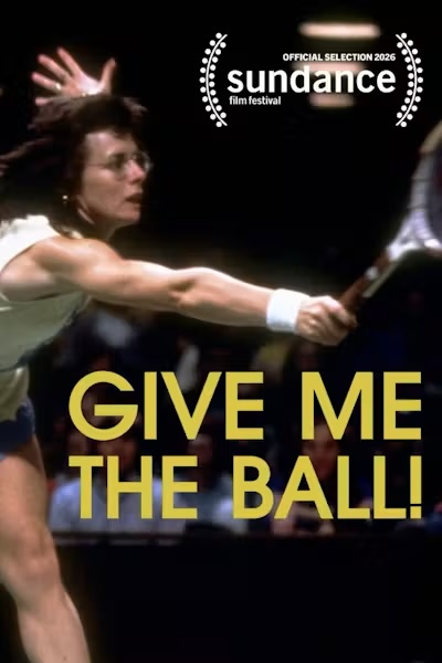 Movie poster for Give Me the Ball! A grainy photograph shows a woman tennis player in glasses and a white wristband lunging, her racket arm fully stretched. A blurred crowd fills the dark stands behind her. The title appears in large yellow capitals.