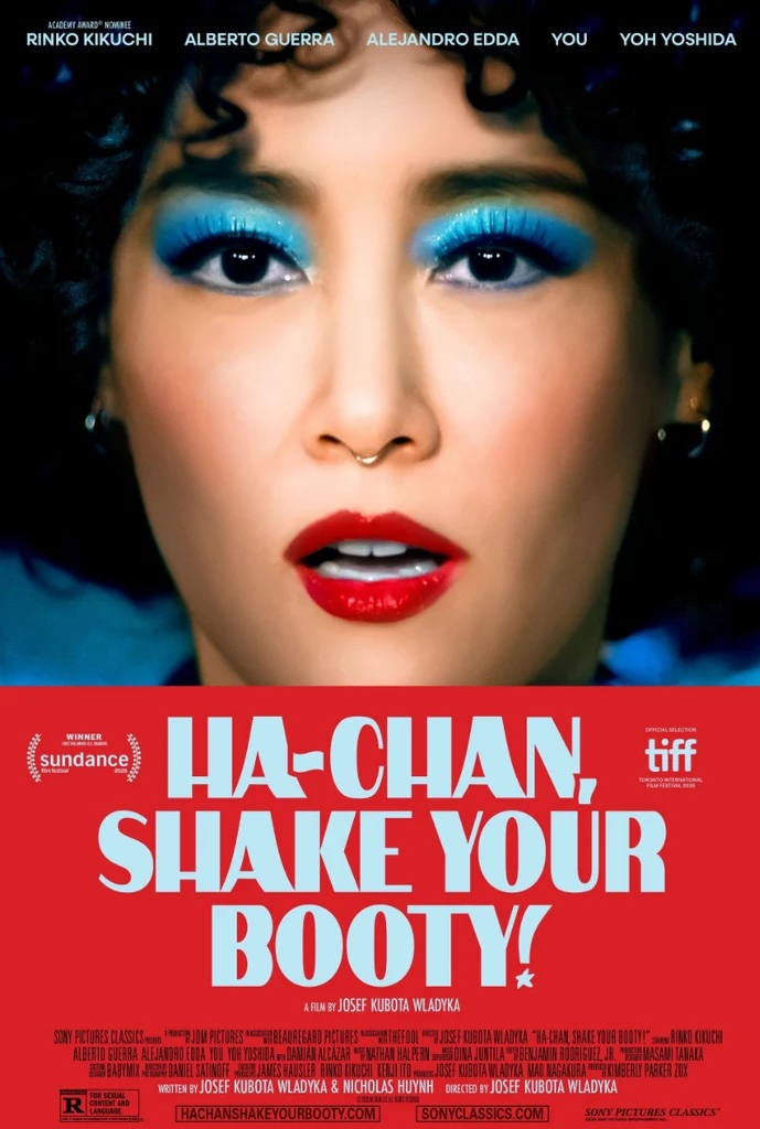 Movie poster for Ha-Chan, Shake Your Booty! Extreme close up of a woman's face filling the upper half of the frame, wearing bright blue eyeshadow, red lipstick, and a gold nose ring, her mouth slightly open. The title appears below on a red band in pale blue capitals on three lines.