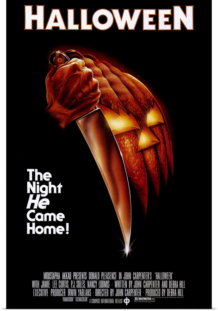 Movie poster for Halloween. Illustration of a hand gripping a kitchen knife against a black background, the blade pointing down. The hand and knife together form the shape of a carved jack-o'-lantern, its lit triangular eyes and mouth glowing orange. The tagline at left reads "The Night He Came Home!"