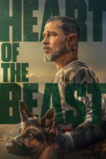 Movie poster for Heart of the Beast. A bearded man in a worn jacket sits in dim forest light, looking toward the camera with a scar visible on his cheek. A German shepherd rests against his side in the lower portion of the frame. The title runs across the poster in large green capitals on four lines, overlapping the image.