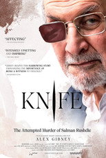 Movie poster for Knife. Salman Rushdie, an older man with a white beard, looks toward the camera through glasses with one darkened lens. Torn white slashes cut across the image, and one runs through the title, which appears in large white capitals. The subtitle beneath reads "The Attempted Murder of Salman Rushdie."
