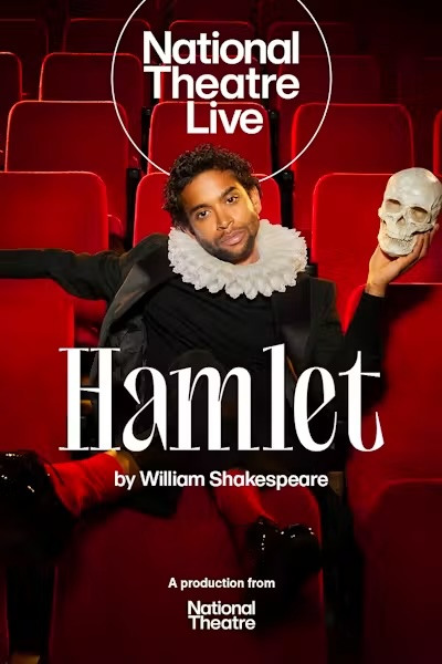 Poster for National Theatre Live: Hamlet. A Black man in black dress with a wide white ruff collar sprawls across red theater seats, one arm flung out, holding up a skull in his left hand and looking toward the camera. The title appears across the center in white, with "by William Shakespeare" beneath it.