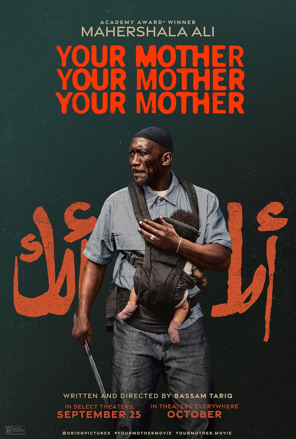 Movie poster for Your Mother. A Black man in a blue work shirt and skullcap stands against a dark green background, a baby strapped to his chest in a carrier and a long blade held down at his side. His face is bruised. Arabic script in orange runs behind him. The title repeats three times at the top in orange capitals. In select theaters September 25.